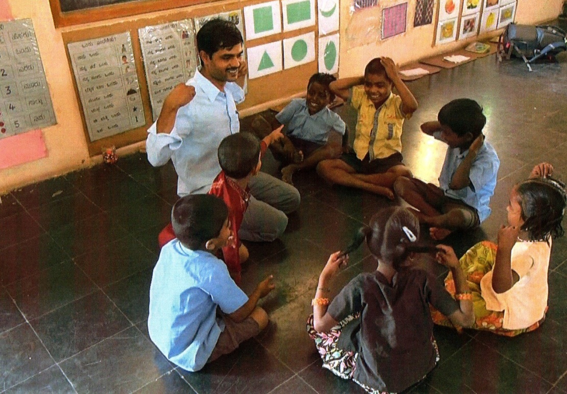 Teacher working with children